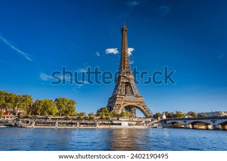Cityscape of Paris with Eiffel Tower at sunny day. France Royalty-Free Stock Photo #2402190495