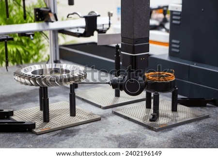 CMM Coordinate Measuring Machine probe inspecting engine part. Industrial manufacturing. Royalty-Free Stock Photo #2402196149
