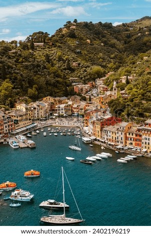 Photos of Portofino, a picturesque fishing village on the Italian Riviera, enchants with its colourful buildings hugging the coastline. Royalty-Free Stock Photo #2402196219