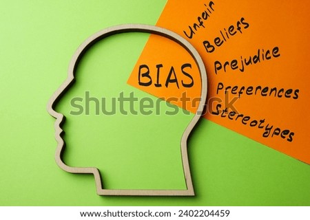 Outline of the head and a sheet of paper with the inscription bias. Royalty-Free Stock Photo #2402204459