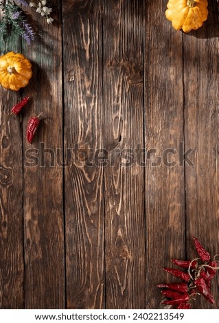 Rustic wooden background with autumn harvest elements, ideal for seasonal themes, top view with copy space.