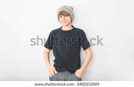 A Teen boy in blank black wearing gray toque t-shirt, isolated on white background. Royalty-Free Stock Photo #2402232069
