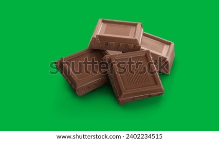 Dark chocolate pieces on green screen 