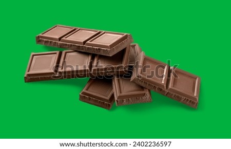 Dark chocolate pieces on green screen 