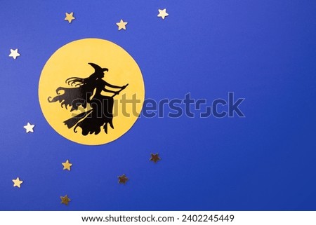 Witch Befana flying on broomstick, moon light.Epiphany day tradition, top view, flat lay, greeting card Royalty-Free Stock Photo #2402245449