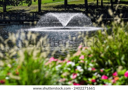 A fountain in a pond in Antioch Park in Merriam, KS