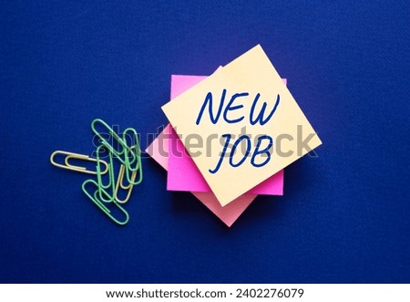 New job symbol. Orange steaky note with concept words New Job. Beautiful deep blue background. Business and New job concept. Copy space.