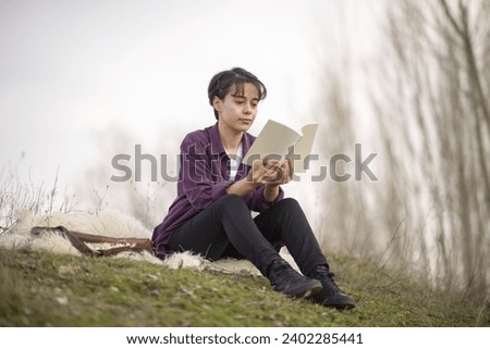 Young and beautiful lady sitting, reading a book, resting, walking, taking photos in an open area