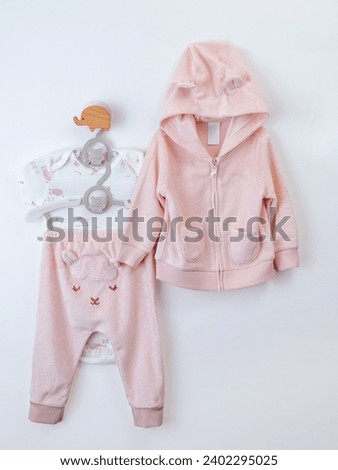 children's clothes on a hanger on a white background. mockup