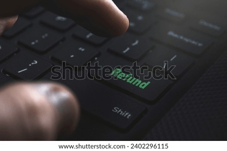 Refund button on keyboard. High quality photo Royalty-Free Stock Photo #2402296115