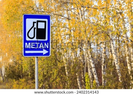 Methane refueling road sign. The inscription Methane in Romanian. Background with selective focus and copy space for text