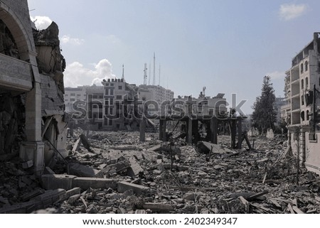  the massive destruction in the Abu Al-Kass area in the Al-Rimal neighborhood in the central Gaza Strip after it was targeted by warplanes Royalty-Free Stock Photo #2402349347