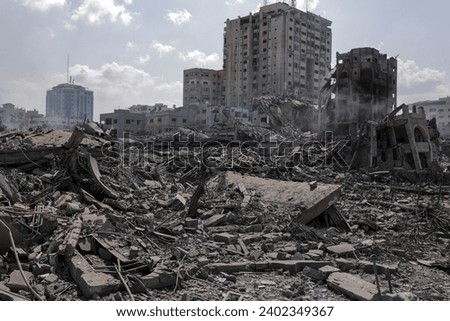  the massive destruction in the Abu Al-Kass area in the Al-Rimal neighborhood in the central Gaza Strip after it was targeted by warplanes Royalty-Free Stock Photo #2402349367
