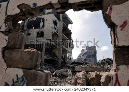 the massive destruction in the Abu Al-Kass area in the Al-Rimal neighborhood in the central Gaza Strip after it was targeted by warplanes Royalty-Free Stock Photo #2402349371