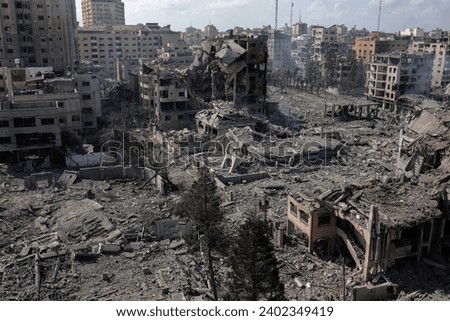  the massive destruction in the Abu Al-Kass area in the Al-Rimal neighborhood in the central Gaza Strip after it was targeted by warplanes Royalty-Free Stock Photo #2402349419