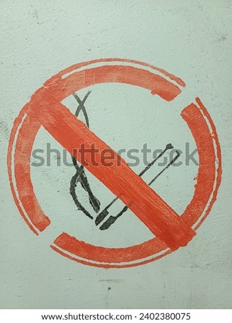 No smoking sign on an old wall