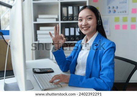 Asian call center girl working to provide customer service through online communication channels, business operator providing customer service online Communicate business information to customers.