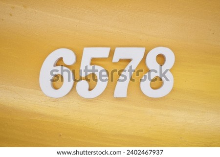The golden yellow painted wood panel for the background, number 6578, is made from white painted wood.