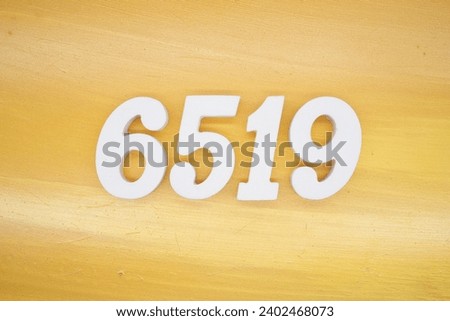The golden yellow painted wood panel for the background, number 6519, is made from white painted wood.