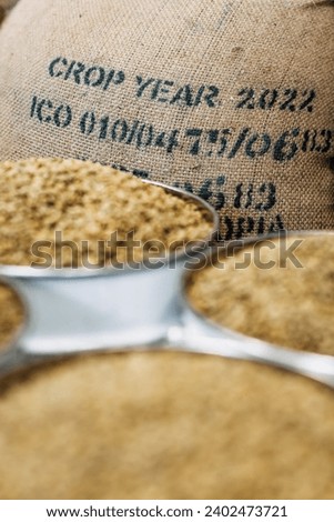 jute bags of imported ethiopian coffee, green beans, roastery facility Royalty-Free Stock Photo #2402473721