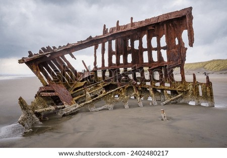 Wreck of the Peter Iredale at Fort Stevens State Park in Oregon, USA Royalty-Free Stock Photo #2402480217