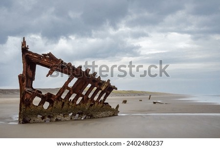 Wreck of the Peter Iredale at Fort Stevens State Park in Oregon, USA Royalty-Free Stock Photo #2402480237