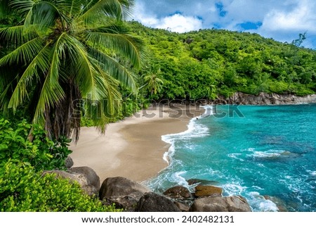Big granite rocks and turquoise ocean water. Summer landscape on a tropical island. Tropical landscape with sunny sky. Panorama of Anse Major Beach, Seyshelles, Mahe Royalty-Free Stock Photo #2402482131