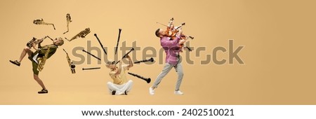 Collage. Young stylish men playing different music instruments, saxophone, clarinet and violin over light background. Concept of human emotions, music, leisure, enjoyment and fun