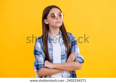 arrogant teen girl in casual style. Young teen girl standing in sunglasses. Beautiful teen girl wearing checkered shirt. teen girl with long hair. expressing arrogance