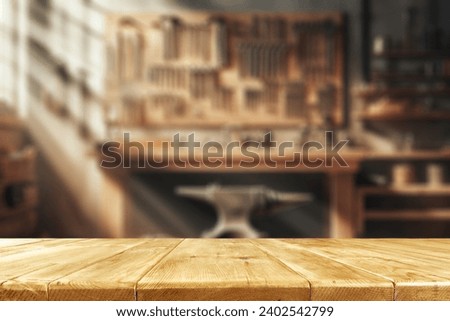 Brown old desk of empty space for your decoration. Blurred background of workshop in home interior. Natural sun light and mood. Mockup and space for your products.  Royalty-Free Stock Photo #2402542799