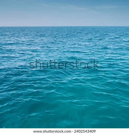 Sea abstract background flow under light exposure. Royalty-Free Stock Photo #2402543409
