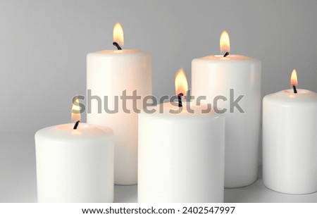 burning white 5 candles light