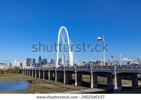 scenic skyline Panorama of Downtown Dallas seen from Trinity River with Margaret hunt hill bridge, Texas Royalty-Free Stock Photo #2402560157