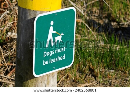 Dogs must be leashed sign