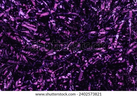 sparkling metallic purple tinsel background Royalty-Free Stock Photo #2402573821