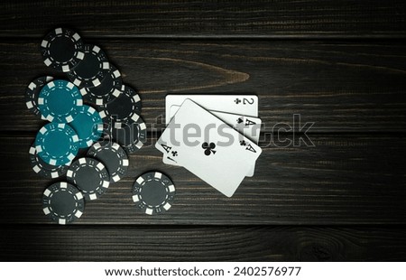 Unsuccessful combination of cards in the popular game of poker. Lose or go bankrupt in a card game or become a loser. Place for advertising on a dark background. Royalty-Free Stock Photo #2402576977