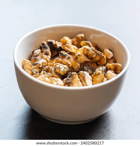 Baked Walnuts in Small White Bowl