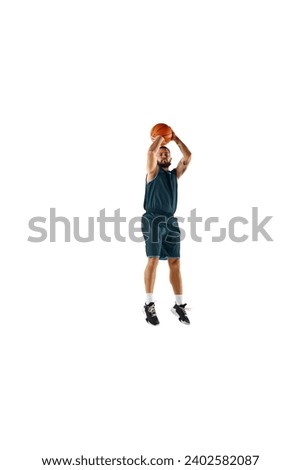 Full length portrait of basketball player workout in motion, highlighting dedication to perfecting craft against white background. Concept of sport, hobby, active lifestyle, power and strength. ad
