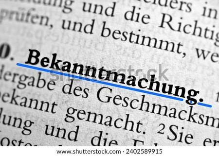 A closeup of the german word Bekanntmachung written in bold font and underlined with blue
Translation- notice, announcement