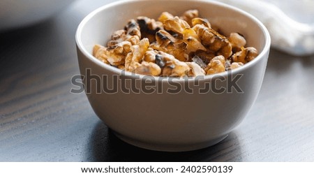 Baked Walnuts in Small White Bowl