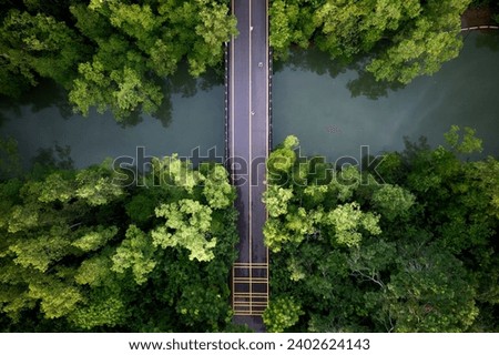 An aerial shot of a bridge over the river in Singapore.