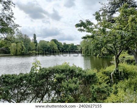 A beautiful view of the Walsall Arboretum park on a cloudy day in England, UK.