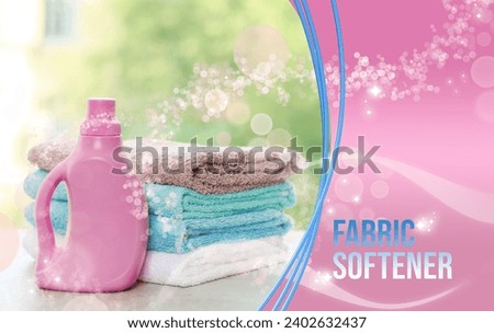 Fabric softener advertising design. Bottle of conditioner and soft clean towels on table