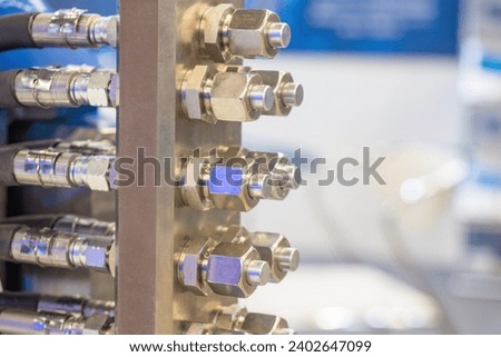 Electrical equipment. Fragment of electrical installation. Hydraulic hoses with fittings. Industrial equipment close-up. Mechanism for insulating electrical appliances. Industrial technology Royalty-Free Stock Photo #2402647099