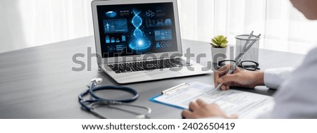 Doctor studying genetic disease in DNA research with laptop, analyze genetic data, formulate medical treatment strategies, and develop healthcare plan for patient with innovative solution. Neoteric Royalty-Free Stock Photo #2402650419