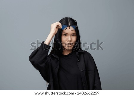 Woman fashion student cute glasses studio background portrait asian smile business face beautiful