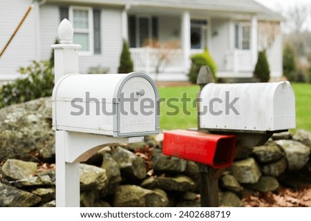 mailbox outside suburban home, symbolizing communication and connection Royalty-Free Stock Photo #2402688719