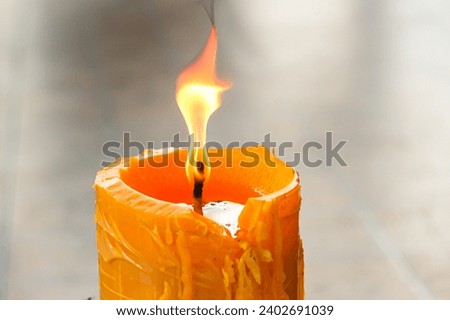Pictures of candle lights blight and burning in temple of Thailand country with concept region of people.