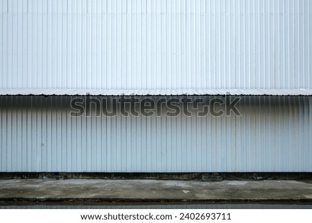 Textured Corrugated Metal Siding on Industrial Building Facade of temporary construction site. 
