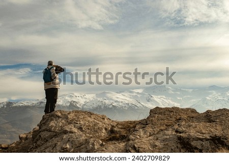 photographer shooting nature and mountain view